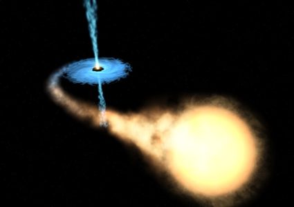 artystyczna wizja gwiazdy połykanej przez czarną dziurę