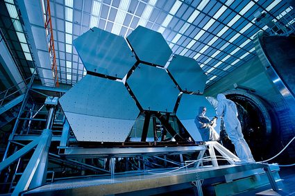 The mirror of a telescope consisting of multiple hexagonal segments.