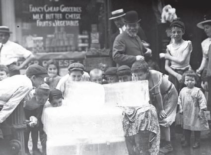 Children around blocks of ice.