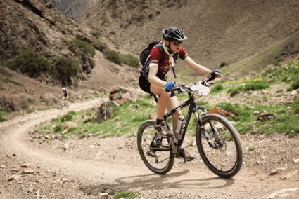 An image of a cyclist going uphill.