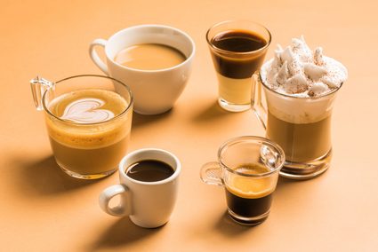 Various styles of coffee drinks on a beige background.