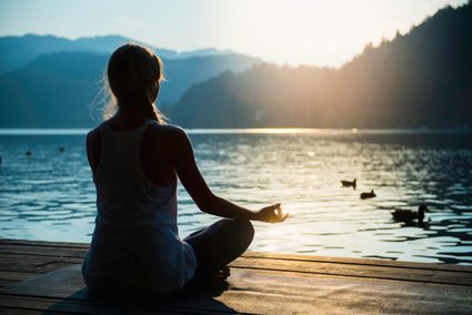 An image of a woman meditating.