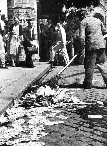 Hyperinflation in 1946 Hungary - sweeping money on the street