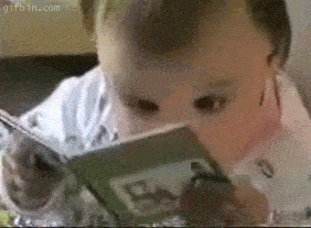 A kid quickly reading a book