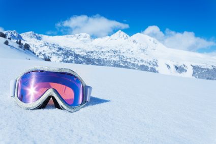 Image of skiing goggles with darkened lenses.