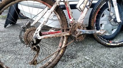 A muddy, dirty bike that needs cleaning.