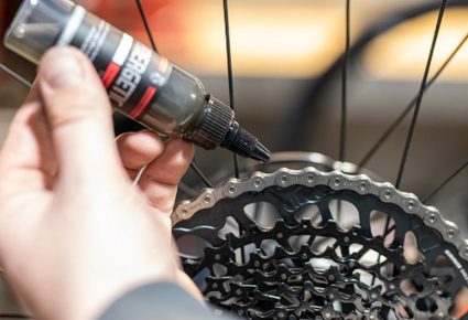 Oil-based lubricant being applied on a bicycle chain.